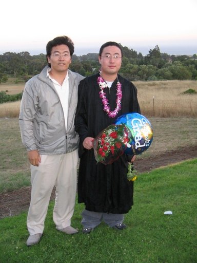 Henry Cho smiling for a photograph